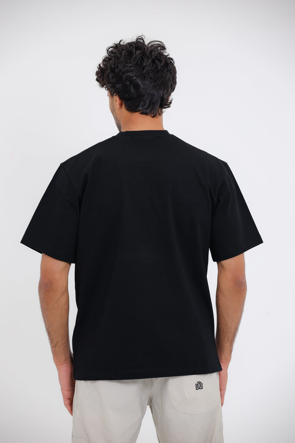 Chest Sprayed ""Most Dynamic Wear"" White Slip On Tee - Black